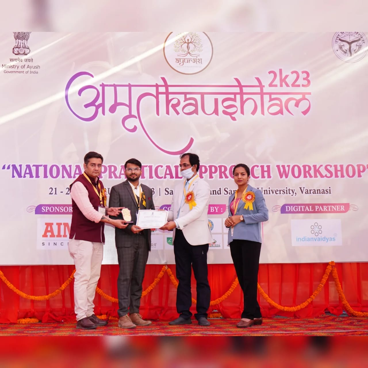 Receiving trophy at national workshop